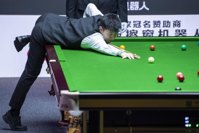(260812) -- TAIYUAN, Aug. 12, 2026 (Xinhua) -- Zhao Xintong of China competes during the round 1 match between Zhao Xintong of China and Zhang Anda of China at China Open 2026 snooker tournament in Taiyuan, north China's Shanxi Province, Aug. 11, 2026. (Xinhua/Cao Yang)