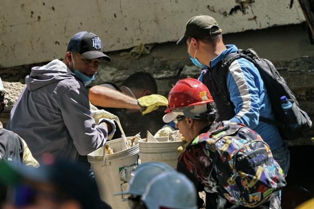 (260812) -- CALI, Aug. 12, 2026 (Xinhua) -- Rescuers conduct search and rescue operation on the ruins of a building damaged in an earthquake in Cali, Colombia, Aug. 11, 2026. The death toll from Monday's 7.4-magnitude earthquake in western Colombia has risen to 188, with 1,677 others injured, the Colombian Association of Capital Cities, or Asocapitales, said Tuesday.
    Asocapitales said it has launched a system to report and search for missing persons as rescue and damage assessment work continues. (COLPRENSA/Handout via Xinhua)