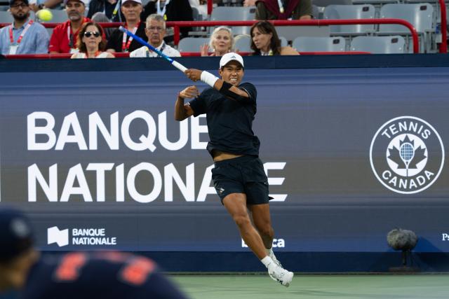 (260812) -- MONTREAL, Aug. 12, 2026 (Xinhua) -- Learner Tien of the United States competes during the men's singles quarterfinal match between Learner Tien of the United States and Daniel Merida of Spain at the 2026 National Bank Open tennis tournament in Montreal, Canada, Aug. 11, 2026. (Photo by Li Haitao/Xinhua)