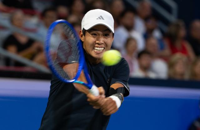 (260812) -- MONTREAL, Aug. 12, 2026 (Xinhua) -- Learner Tien of the United States competes during the men's singles quarterfinal match between Learner Tien of the United States and Daniel Merida of Spain at the 2026 National Bank Open tennis tournament in Montreal, Canada, Aug. 11, 2026. (Photo by Li Haitao/Xinhua)