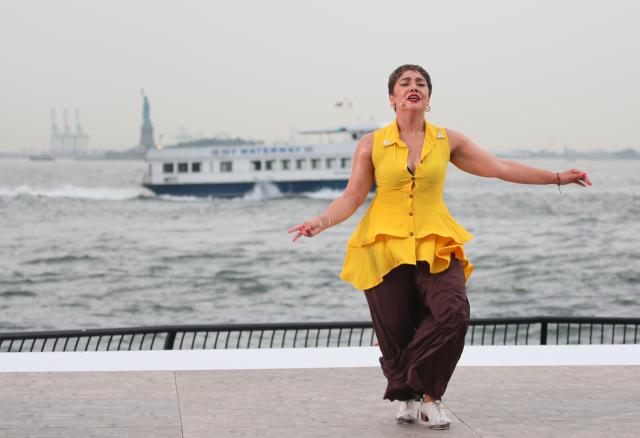(260812) -- NEW YORK, Aug. 12, 2026 (Xinhua) -- A dancer performs during the Battery Dance Festival at the Battery Park of Manhattan in New York, the United States, On Aug. 11, 2026. The 45th annual Battery Dance Festival kicked off at an outdoor stage with New York Harbor in the background here on Tuesday. (Xinhua/Zhang Fengguo)