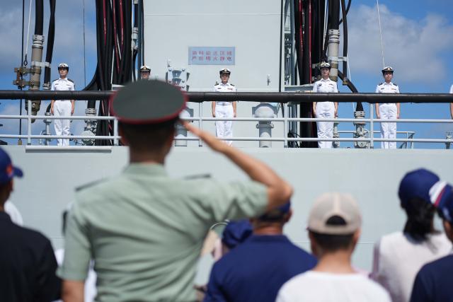 (260812) -- SANYA, Aug. 12, 2026 (Xinhua) -- A farewell ceremony is held for the 49th escort fleet of the Chinese People's Liberation Army Navy at a military port in Sanya, south China's Hainan Province, Aug. 12, 2026. The 49th escort fleet of the Chinese People's Liberation Army Navy on Wednesday morning departed from a military port in Sanya, south China's Hainan Province, bound for the Gulf of Aden and waters off Somalia to carry out escort missions in the region.
   The fleet consists of the guided-missile destroyer Kunming, the guided-missile frigate Yueyang and the comprehensive supply ship Luomahu, with dozens of special operations personnel and two helicopters on board. (Photo by Wen Bin/Xinhua)