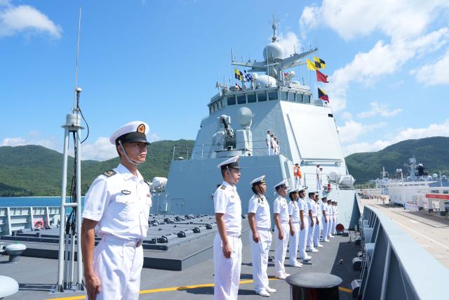 (260812) -- SANYA, Aug. 12, 2026 (Xinhua) -- Officers and soldiers stand in formation at a military port in Sanya, south China's Hainan Province, Aug. 12, 2026. The 49th escort fleet of the Chinese People's Liberation Army Navy on Wednesday morning departed from a military port in Sanya, south China's Hainan Province, bound for the Gulf of Aden and waters off Somalia to carry out escort missions in the region.
   The fleet consists of the guided-missile destroyer Kunming, the guided-missile frigate Yueyang and the comprehensive supply ship Luomahu, with dozens of special operations personnel and two helicopters on board. (Photo by Deng Jiajin/Xinhua)