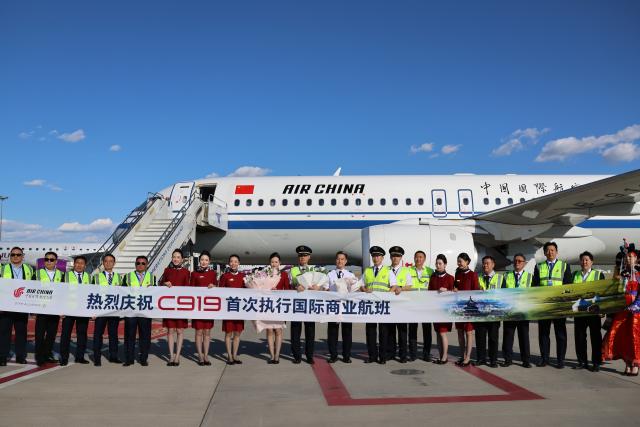 (260812) -- ULAN BATOR, Aug. 12, 2026 (Xinhua) -- Crew members of Air China pose for group photos at the new Ulan Bator airport in Mongolia, Aug. 12, 2026. China's homegrown C919 large passenger aircraft landed safely at the new Ulan Bator airport in Mongolia on Wednesday afternoon after departing from Beijing Capital International Airport, marking the completion of the aircraft's first scheduled international commercial passenger flight.
   This is the first international route opened after the C919 entered commercial operation, marking the official transition of China's domestically developed mainline passenger aircraft into a new phase of regular international operations. (Xinhua/Bolortsetseg)