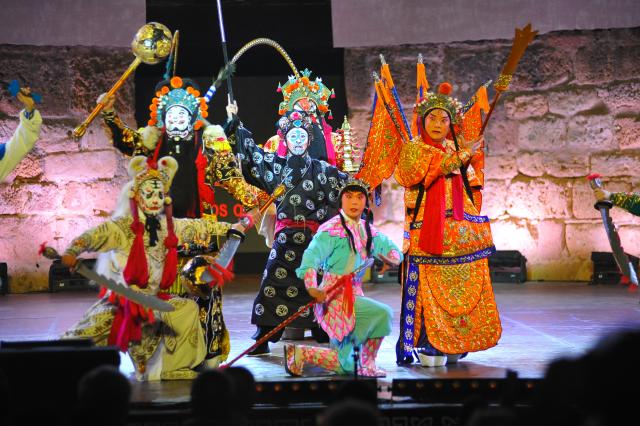 (260812) -- TUNIS, Aug. 12, 2026 (Xinhua) -- Artists of the China National Peking Opera Company perform at the ancient theatre of Carthage in Tunis, Tunisia, Aug. 11, 2026. The China National Peking Opera Company presented a performance on Tuesday at the "Folklores of the World" event during the 60th Carthage Festival in Tunis. (Photo by Adel Ezzine/Xinhua)