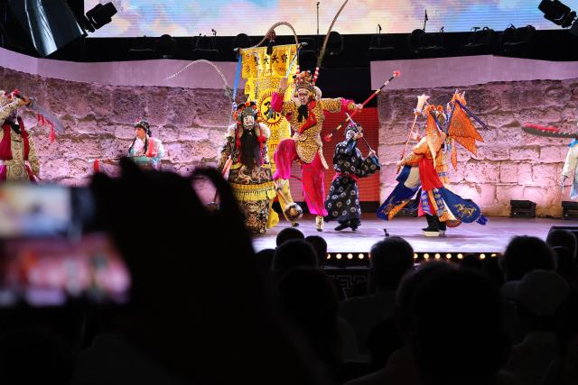 (260812) -- TUNIS, Aug. 12, 2026 (Xinhua) -- Artists of the China National Peking Opera Company perform at the ancient theatre of Carthage in Tunis, Tunisia, Aug. 11, 2026. The China National Peking Opera Company presented a performance on Tuesday at the "Folklores of the World" event during the 60th Carthage Festival in Tunis. (Xinhua/Zhou Haojin)