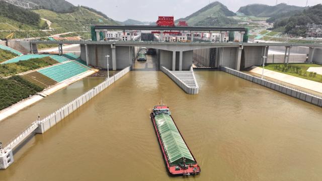 (260812) -- LINGSHAN, Aug. 12, 2026 (Xinhua) -- An aerial drone photo taken on Aug. 12, 2026 shows a trial vessel driving out of a navigation lock on the Pinglu Canal in south China's Guangxi Zhuang Autonomous Region. Pinglu Canal started vessel trials on Wednesday, marking a key step toward the planned opening of this major Chinese waterway in September.
   The tests will assess navigation under both normal and adverse conditions and examine whether the canal's waterways, locks, anchorages, service areas and navigation facilities are ready for operation.
   Designed to accommodate vessels of up to 5,000 tonnes, the 134.2-km Pinglu Canal is China's first major river-to-sea canal project planned and coordinated at the national level since 1949.
   Stretching from the Pingtang River in Guangxi's Hengzhou City to the Beibu Gulf in the South China Sea, the canal is the backbone of the country's New International Land-Sea Trade Corridor, which has evolved into a strategic route linking China's inland regions with ASEAN and other global markets. (Xinhua/Zhou Hua)