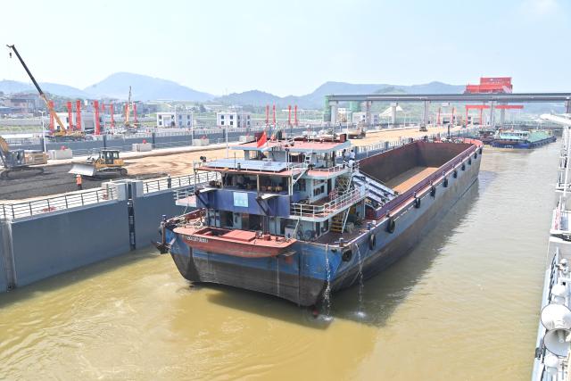 (260812) -- LINGSHAN, Aug. 12, 2026 (Xinhua) -- A trial vessel drives into a navigation lock on the Pinglu Canal in south China's Guangxi Zhuang Autonomous Region, on Aug. 12, 2026. Pinglu Canal started vessel trials on Wednesday, marking a key step toward the planned opening of this major Chinese waterway in September.
   The tests will assess navigation under both normal and adverse conditions and examine whether the canal's waterways, locks, anchorages, service areas and navigation facilities are ready for operation.
   Designed to accommodate vessels of up to 5,000 tonnes, the 134.2-km Pinglu Canal is China's first major river-to-sea canal project planned and coordinated at the national level since 1949.
   Stretching from the Pingtang River in Guangxi's Hengzhou City to the Beibu Gulf in the South China Sea, the canal is the backbone of the country's New International Land-Sea Trade Corridor, which has evolved into a strategic route linking China's inland regions with ASEAN and other global markets. (Xinhua/Zhou Hua)