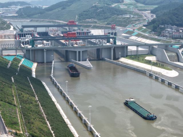 (260812) -- LINGSHAN, Aug. 12, 2026 (Xinhua) -- An aerial drone photo taken on Aug. 12, 2026 shows trial vessels driving out of a navigation lock on the Pinglu Canal in south China's Guangxi Zhuang Autonomous Region. Pinglu Canal started vessel trials on Wednesday, marking a key step toward the planned opening of this major Chinese waterway in September.
   The tests will assess navigation under both normal and adverse conditions and examine whether the canal's waterways, locks, anchorages, service areas and navigation facilities are ready for operation.
   Designed to accommodate vessels of up to 5,000 tonnes, the 134.2-km Pinglu Canal is China's first major river-to-sea canal project planned and coordinated at the national level since 1949.
   Stretching from the Pingtang River in Guangxi's Hengzhou City to the Beibu Gulf in the South China Sea, the canal is the backbone of the country's New International Land-Sea Trade Corridor, which has evolved into a strategic route linking China's inland regions with ASEAN and other global markets. (Xinhua/Zhou Hua)