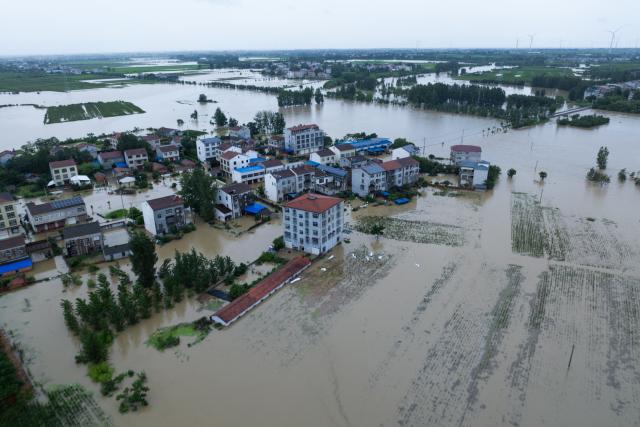 (260812) -- XIANGYANG, Aug. 12, 2026 (Xinhua) -- An aerial drone photo taken on Aug. 12, 2026 shows a view of Nanwang Village of Xiangzhou District, Xiangyang City of central China's Hubei Province. Torrential rains and flooding caused by Typhoon Dolphin, the 13th typhoon of the year, have swept vast regions in eastern and central China. Local authorities are exerting all efforts to eradicate potential risks and put people's life back to normal. (Xinhua/Wu Zhizun)
