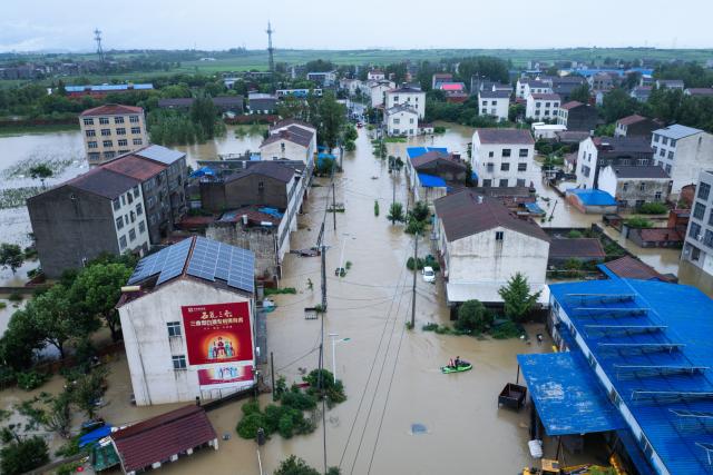 (260812) -- XIANGYANG, Aug. 12, 2026 (Xinhua) -- An aerial drone photo taken on Aug. 12, 2026 shows a view of Nanwang Village of Xiangzhou District, Xiangyang City of central China's Hubei Province. Torrential rains and flooding caused by Typhoon Dolphin, the 13th typhoon of the year, have swept vast regions in eastern and central China. Local authorities are exerting all efforts to eradicate potential risks and put people's life back to normal. (Xinhua/Wu Zhizun)