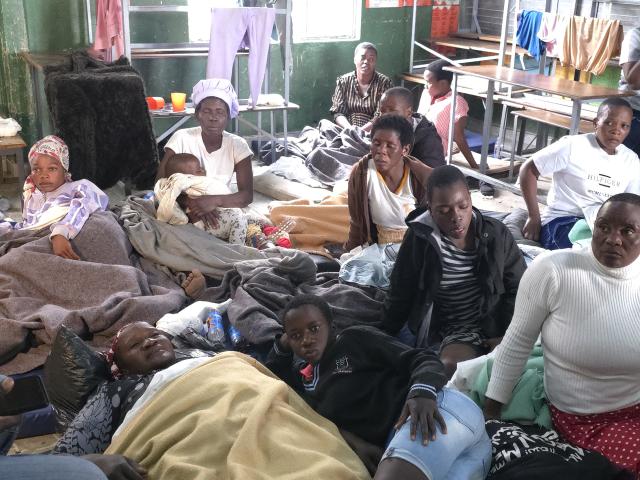 (260812) -- HARARE, Aug. 12, 2026 (Xinhua) -- Photo taken with a mobile phone shows survivors of a boat capsize on Lake Kariba taking shelter at a school in Mashonaland West Province, Zimbabwe, on August 12, 2026. Zimbabwean President Emmerson Mnangagwa on Wednesday declared a state of disaster following a boat capsize in Lake Kariba, as police confirmed the death toll from the tragedy had risen to 44. (Str/Xinhua)