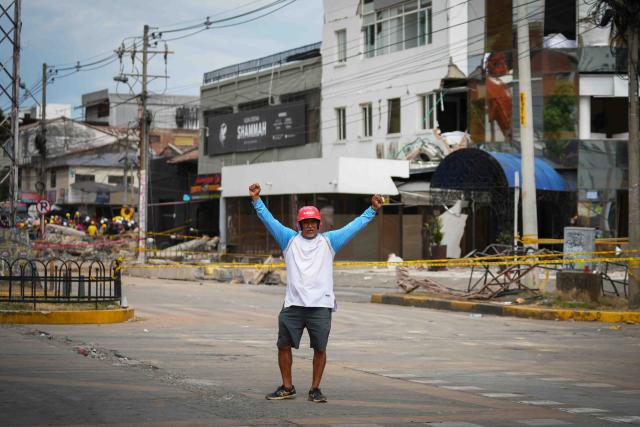 (260812) -- CALI, Aug. 12, 2026 (Xinhua) -- A rescuer gestures for silence during search and rescue operations after an earthquake in Cali, Colombia, Aug. 12, 2026. The death toll from Monday's 7.4-magnitude earthquake in western Colombia has risen to 241, with 3,771 others injured, Colombian media reported Wednesday, citing figures from the National Unit for Disaster Risk Management. (Photo by Andres Moreno/Xinhua)