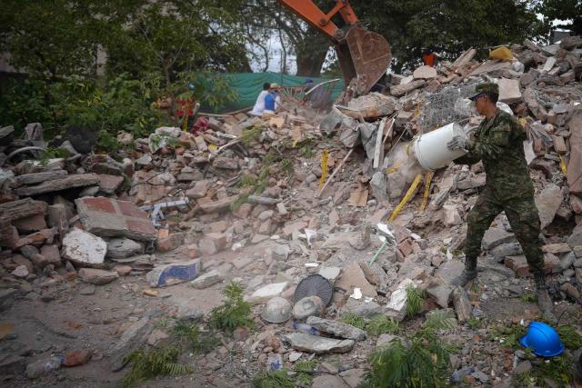 (260812) -- CALI, Aug. 12, 2026 (Xinhua) -- Rescuers conduct search and rescue operations after an earthquake in Cali, Colombia, Aug. 12, 2026. The death toll from Monday's 7.4-magnitude earthquake in western Colombia has risen to 241, with 3,771 others injured, Colombian media reported Wednesday, citing figures from the National Unit for Disaster Risk Management. (Photo by Andres Moreno/Xinhua)