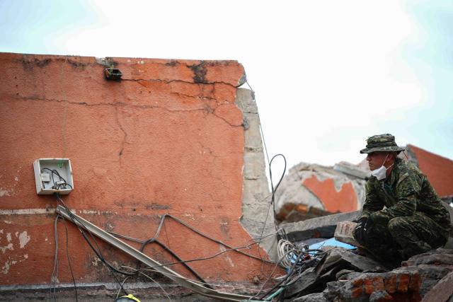 (260812) -- CALI, Aug. 12, 2026 (Xinhua) -- A rescuer conducts search and rescue operations on the ruins of a building damaged in an earthquake in Cali, Colombia, Aug. 12, 2026. The death toll from Monday's 7.4-magnitude earthquake in western Colombia has risen to 241, with 3,771 others injured, Colombian media reported Wednesday, citing figures from the National Unit for Disaster Risk Management. (Photo by Andres Moreno/Xinhua)