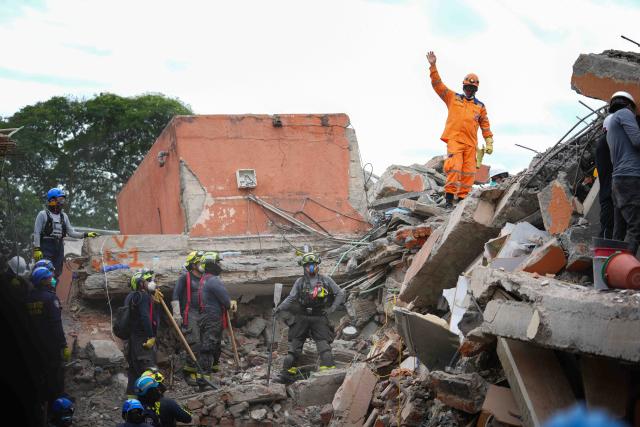 (260812) -- CALI, Aug. 12, 2026 (Xinhua) -- Rescuers conduct search and rescue operations on the ruins of a building damaged in an earthquake in Cali, Colombia, Aug. 12, 2026. The death toll from Monday's 7.4-magnitude earthquake in western Colombia has risen to 241, with 3,771 others injured, Colombian media reported Wednesday, citing figures from the National Unit for Disaster Risk Management. (Photo by Andres Moreno/Xinhua)