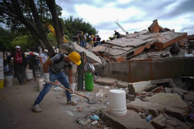 (260812) -- CALI, Aug. 12, 2026 (Xinhua) -- Rescuers conduct search and rescue operations on the ruins of a building damaged in an earthquake in Cali, Colombia, Aug. 12, 2026. The death toll from Monday's 7.4-magnitude earthquake in western Colombia has risen to 241, with 3,771 others injured, Colombian media reported Wednesday, citing figures from the National Unit for Disaster Risk Management. (Photo by Andres Moreno/Xinhua)