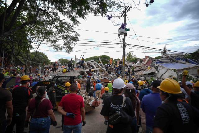 (260812) -- CALI, Aug. 12, 2026 (Xinhua) -- Rescuers conduct search and rescue operations on the ruins of a building damaged in an earthquake in Cali, Colombia, Aug. 12, 2026. The death toll from Monday's 7.4-magnitude earthquake in western Colombia has risen to 241, with 3,771 others injured, Colombian media reported Wednesday, citing figures from the National Unit for Disaster Risk Management. (Photo by Andres Moreno/Xinhua)