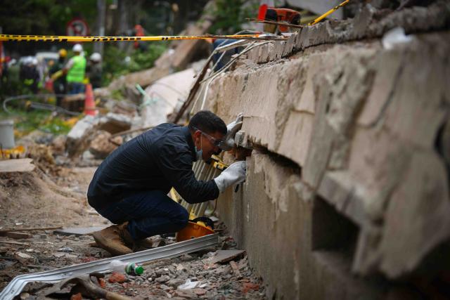(260812) -- CALI, Aug. 12, 2026 (Xinhua) -- A rescuer conducts search and rescue operations on the ruins of a building damaged in an earthquake in Cali, Colombia, Aug. 12, 2026. The death toll from Monday's 7.4-magnitude earthquake in western Colombia has risen to 241, with 3,771 others injured, Colombian media reported Wednesday, citing figures from the National Unit for Disaster Risk Management. (Photo by Andres Moreno/Xinhua)