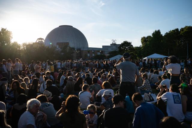 (260812) -- BERLIN, Aug. 12, 2026 (Xinhua) -- People observe the partial solar eclipse at the Zeiss Grand Planetarium in Berlin, Germany, Aug. 12, 2026. The Long Night of Astronomy event was held here on Wednesday, inviting the public to observe the solar eclipse and experience the fascination of astronomy. (Xinhua/Zhang Haofu)