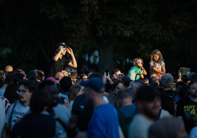 (260812) -- BERLIN, Aug. 12, 2026 (Xinhua) -- People observe the partial solar eclipse at the Zeiss Grand Planetarium in Berlin, Germany, Aug. 12, 2026. The Long Night of Astronomy event was held here on Wednesday, inviting the public to observe the solar eclipse and experience the fascination of astronomy. (Xinhua/Zhang Haofu)