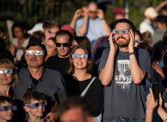 (260812) -- BERLIN, Aug. 12, 2026 (Xinhua) -- People observe the partial solar eclipse at the Zeiss Grand Planetarium in Berlin, Germany, Aug. 12, 2026. The Long Night of Astronomy event was held here on Wednesday, inviting the public to observe the solar eclipse and experience the fascination of astronomy. (Xinhua/Zhang Haofu)
