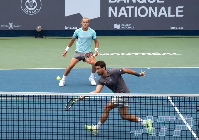 (260813) -- MONTREAL, Aug. 13, 2026 (Xinhua) -- Orlando Luz(front)/Rafael Matos of Brazil compete during the men's doubles semifinal match between Orlando Luz/Rafael Matos of Brazil and Francisco Cerundolo/Tomas Martin Etcheverry of Argentina at the 2026 National Bank Open tennis tournament in Montreal, Canada, Aug. 12, 2026. (Photo by Li Haitao/Xinhua)