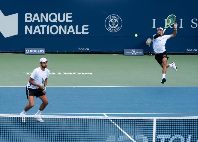 (260813) -- MONTREAL, Aug. 13, 2026 (Xinhua) -- Marcelo Arevalo(R)/Mate Pavic compete during the men's doubles semifinal match between Marcelo Arevalo(El Salvador)/Mate Pavic(Croatia) and Theo Arribage/Albano Olivetti of France at the 2026 National Bank Open tennis tournament in Montreal, Canada, Aug. 12, 2026. (Photo by Li Haitao/Xinhua)