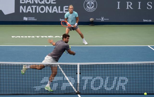 (260813) -- MONTREAL, Aug. 13, 2026 (Xinhua) -- Orlando Luz(front)/Rafael Matos of Brazil compete during the men's doubles semifinal match between Orlando Luz/Rafael Matos of Brazil and Francisco Cerundolo/Tomas Martin Etcheverry of Argentina at the 2026 National Bank Open tennis tournament in Montreal, Canada, Aug. 12, 2026. (Photo by Li Haitao/Xinhua)