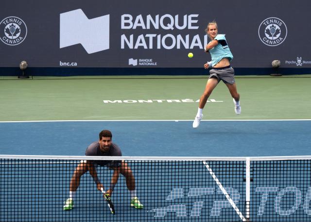 (260813) -- MONTREAL, Aug. 13, 2026 (Xinhua) -- Orlando Luz/Rafael Matos (R) of Brazil compete during the men's doubles semifinal match between Orlando Luz/Rafael Matos of Brazil and Francisco Cerundolo/Tomas Martin Etcheverry of Argentina at the 2026 National Bank Open tennis tournament in Montreal, Canada, Aug. 12, 2026. (Photo by Li Haitao/Xinhua)