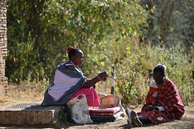 (260813) -- NAROK, Aug. 13, 2026 (Xinhua) -- Maasai villagers sell goods at a village around the Maasai Mara National Reserve in Narok, Kenya, on Aug. 12, 2026.
  The Maasai, one of the major tribes in Kenya, are still living a nomadic lifestyle. As local tourism develops, Maasai people have opened their villages to tourists to increase their income. (Xinhua/Liu Qiong)