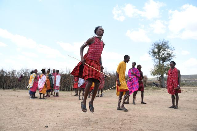 (260813) -- NAROK, Aug. 13, 2026 (Xinhua) -- Maasai villagers perform traditional dance at a village around the Maasai Mara National Reserve in Narok, Kenya, on Aug. 12, 2026.
  The Maasai, one of the major tribes in Kenya, are still living a nomadic lifestyle. As local tourism develops, Maasai people have opened their villages to tourists to increase their income. (Xinhua/Liu Qiong)