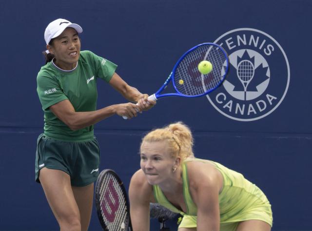(260813) -- TORONTO, Aug. 13, 2026 (Xinhua) -- Katerina Siniakova/Zhang Shuai (L) compete during the women's doubles semifinal match between Katerina Siniakova (the Czech Republic)/Zhang Shuai (China) and Tereza Mihalikova (Slovakia)/Olivia Nicholls (Britain) at the 2026 National Bank Open tennis tournament in Toronto, Canada, Aug. 12, 2026. (Photo by Zou Zheng/Xinhua)