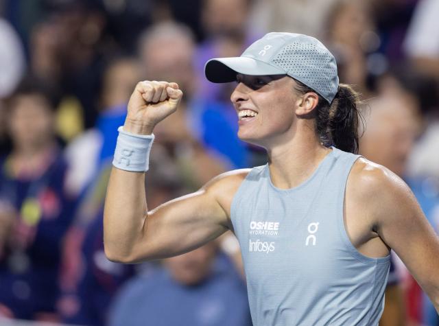 (260813) -- TORONTO, Aug. 13, 2026 (Xinhua) -- Iga Swiatek of Poland celebrates victory after the women's singles semifinal match between Elina Svitolina of Ukraine and Iga Swiatek of Poland at the 2026 National Bank Open tennis tournament in Toronto, Canada, on Aug. 12, 2026. (Photo by Zou Zheng/Xinhua)