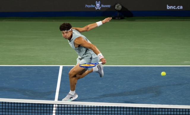 (260813) -- MONTREAL, Aug. 13, 2026 (Xinhua) -- Ben Shelton of the United States returns the ball during the men's singles semifinal match between Ben Shelton of the United States and Learner Tien of the United States at the 2026 National Bank Open tennis tournament in Montreal, Canada, Aug. 12, 2026. (Photo by Li Haitao/Xinhua)