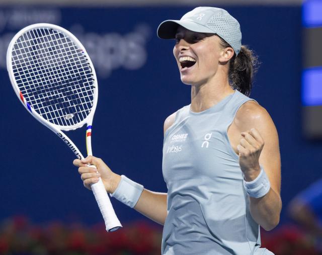 (260813) -- TORONTO, Aug. 13, 2026 (Xinhua) -- Iga Swiatek of Poland celebrates victory after the women's singles semifinal match between Elina Svitolina of Ukraine and Iga Swiatek of Poland at the 2026 National Bank Open tennis tournament in Toronto, Canada, on Aug. 12, 2026. (Photo by Zou Zheng/Xinhua)