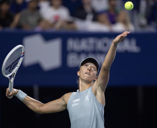 (260813) -- TORONTO, Aug. 13, 2026 (Xinhua) -- Iga Swiatek of Poland serves during the women's singles semifinal match between Elina Svitolina of Ukraine and Iga Swiatek of Poland at the 2026 National Bank Open tennis tournament in Toronto, Canada, on Aug. 12, 2026. (Photo by Zou Zheng/Xinhua)
