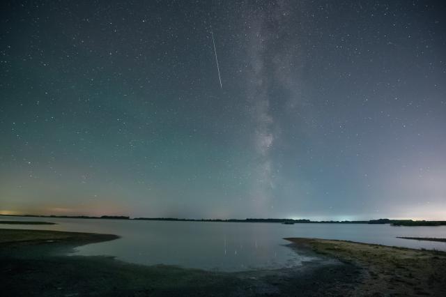 (260813) -- BEIJING, Aug. 13, 2026 (Xinhua) -- This photo taken on Aug. 10, 2026 shows Perseid meteor shower over Qiqihar, northeast China's Heilongjiang Province. Perseid meteor shower, which peaks on August 12 and 13 this year, is an annual meteor shower that occurs from mid-July to late August. (Photo by Wang Yonggang/Xinhua)
