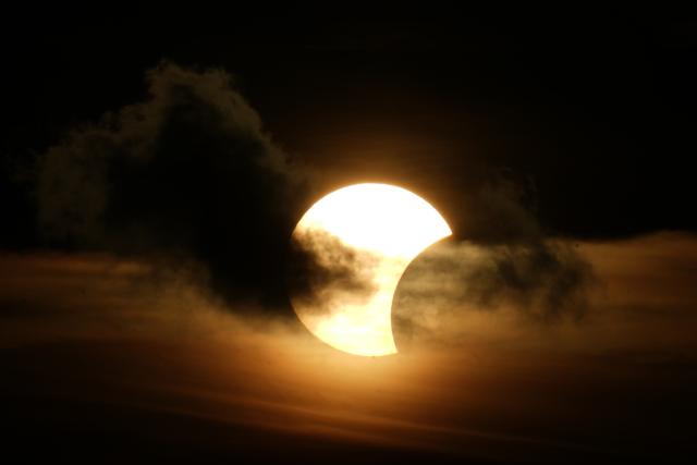 (260813) -- RIGA, Aug. 13, 2026 (Xinhua) -- This photo taken on Aug. 12, 2026 shows a partial solar eclipse over the Baltic Sea in Riga, Latvia. (Photo by Edijs Palens/Xinhua)