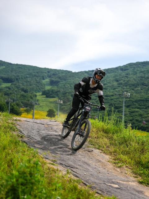 (260813) -- JILIN, Aug. 13, 2026 (Xinhua) -- A tourist rides the mountain bike at the Lake Songhua Resort in Jilin City, northeast China's Jilin Province, Aug. 12, 2026. The Lake Songhua Resort, located in Jilin City, is a national-level ski tourism resort. In recent years, relying on its mountain resources, the resort has extended operation in other seasons except for winter, attracting tourists with natural scenery and mountain sports. 
   Since April 25 this year, the resort has received a total of 200,000 visitors, a year-on-year growth of 20 percent. From popular destination in winter to year-round operation, the tourism potential of the resort is being fully tapped, promoting the high-quality development of the local cultural and tourism industry. (Xinhua/Zhang Nan)