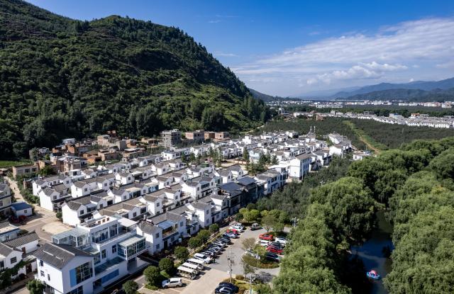 (260813) -- ZHAOTONG, Aug. 13, 2026 (Xinhua) -- An aerial drone photo taken on Aug. 13, 2026 shows a view of Lyuyintang Natural Village of Xunlong Village, Sayu Town, Zhaoyang District, Zhaotong City, southwest China's Yunnan Province. In recent years, Zhaoyang District in Zhaotong City has leveraged its cool and pleasant climate to boost the in-depth sojourn tourism experience as a summer retreat.
   The local government has introduced special support policies for summer retreat tourism, optimizing services including dining, lodging, transportation, sightseeing, shopping, and entertainment. (Xinhua/Chen Xinbo)