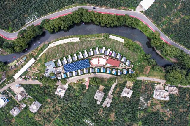 (260813) -- ZHAOTONG, Aug. 13, 2026 (Xinhua) -- An aerial drone photo taken on Aug. 13, 2026 shows a hot spring hotel in Xunlong Village of Sayu Town, Zhaoyang District in Zhaotong City, southwest China's Yunnan Province. In recent years, Zhaoyang District in Zhaotong City has leveraged its cool and pleasant climate to boost the in-depth sojourn tourism experience as a summer retreat.
   The local government has introduced special support policies for summer retreat tourism, optimizing services including dining, lodging, transportation, sightseeing, shopping, and entertainment. (Xinhua/Chen Xinbo)