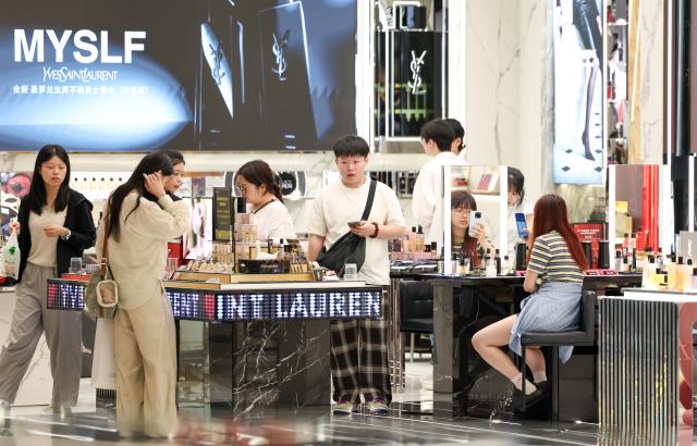 (260813) -- HAIKOU, Aug. 13, 2026 (Xinhua) -- Customers shop at Haikou International Duty Free Shopping Complex in Haikou, south China's Hainan Province, July 18, 2026. Hainan is stepping up with efforts to build a world-class destination for international tourism and consumption as a key component of the Hainan Free Trade Port, and to probe for a new path towards high-quality development in its tourism-led consumer economy with distinctive local characteristics. 
   Hainan is projected to annually receive 154 million counts of domestic and international visits by 2030, along with tourism-related revenue of 363 billion yuan (about 53.83 billion U.S. dollars). (Xinhua/Yang Guanyu)