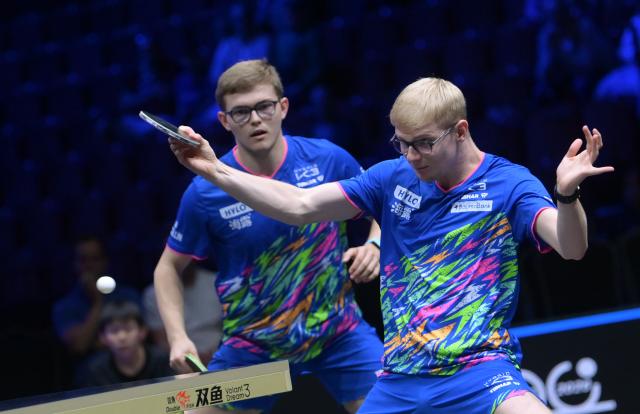 (260813) -- MALMO, Aug. 13, 2026 (Xinhua) -- Alexis Lebrun/Felix Lebrun (R) compete during the men's doubles quarterfinal match between China's Lin Shidong/Wen Ruibo and Alexis Lebrun/Felix Lebrun of France at the WTT Europe Smash Sweden 2026 in Malmo, Sweden, Aug. 13, 2026. (Xinhua/Weng Xinyang)
