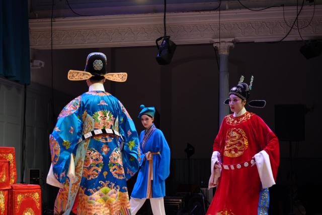 (260813) -- EDINBURGH, Aug. 13, 2026 (Xinhua) -- Chinese Huangmei Opera actress Han Zaifen (1st R) and other actors perform Chinese Huangmei Opera during a performance at the Queen's Hall in Edinburgh, Britain, Aug. 12, 2026. TO GO WITH "Feature: Chinese Huangmei opera heroine brings tale of courage to Edinburgh" (Xinhua/Zhao Jiasong)