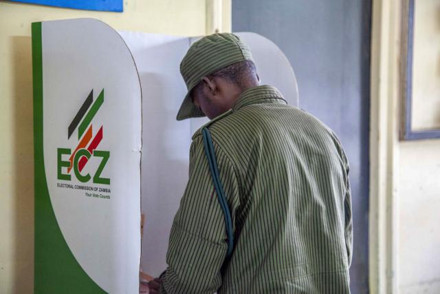 (260813) -- LUSAKA, Aug. 13, 2026 (Xinhua) -- A voter marks a ballot paper at a polling station in Lusaka, Zambia, on Aug. 13, 2026. Zambian voters turned out in large numbers on Thursday to cast their ballots in the general elections amid a largely peaceful atmosphere. (Photo by Martin Mbangweta/Xinhua)