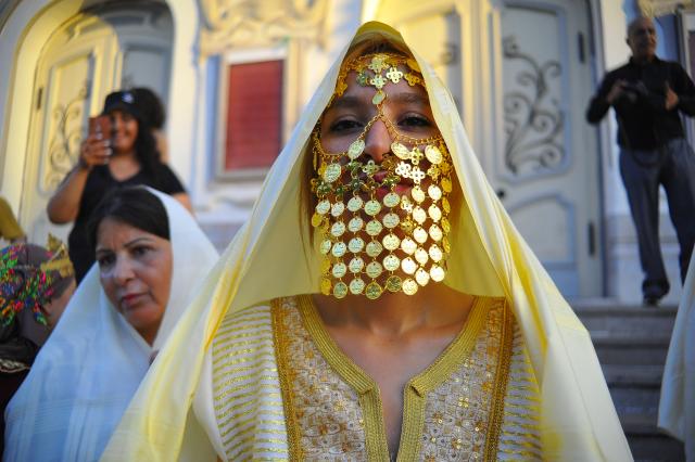 (260813) -- TUNIS, Aug. 13, 2026 (Xinhua) -- A Tunisian woman in traditional costumes is pictured during the celebration of the annual National Women's Day in Tunis, Tunisia, Aug. 13, 2026. (Photo by Adel Ezzine/Xinhua)