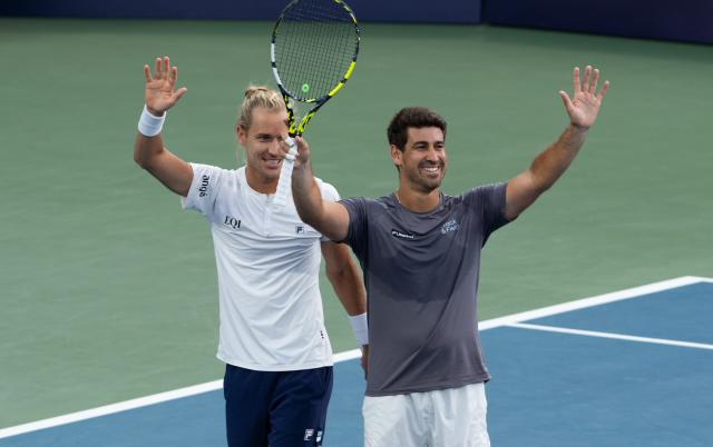 (260814) -- MONTREAL, Aug. 14, 2026 (Xinhua) -- Orlando Luz (R)/Rafael Matos celebrate after winning the men's doubles final match between Orlando Luz/Rafael Matos of Brazil and Marcelo Arevalo (El Salvador)/Mate Pavic (Croatia) at the 2026 National Bank Open tennis tournament in Montreal, Canada, Aug. 13, 2026. (Photo by Li Haitao/Xinhua)