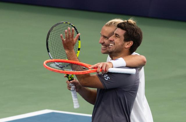 (260814) -- MONTREAL, Aug. 14, 2026 (Xinhua) -- Orlando Luz (front)/Rafael Matos celebrate after winning the men's doubles final match between Orlando Luz/Rafael Matos of Brazil and Marcelo Arevalo (El Salvador)/Mate Pavic (Croatia) at the 2026 National Bank Open tennis tournament in Montreal, Canada, Aug. 13, 2026. (Photo by Li Haitao/Xinhua)