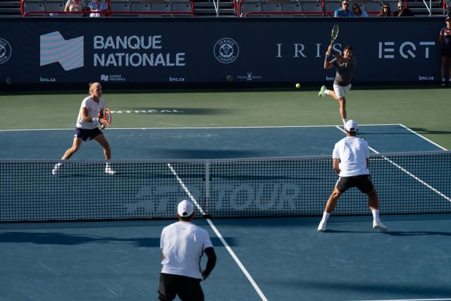 (260814) -- MONTREAL, Aug. 14, 2026 (Xinhua) -- Orlando Luz (top R)/Rafael Matos (1st L) compete during the men's doubles final match between Orlando Luz/Rafael Matos of Brazil and Marcelo Arevalo (El Salvador)/Mate Pavic (Croatia) at the 2026 National Bank Open tennis tournament in Montreal, Canada, Aug. 13, 2026. (Photo by Li Haitao/Xinhua)
